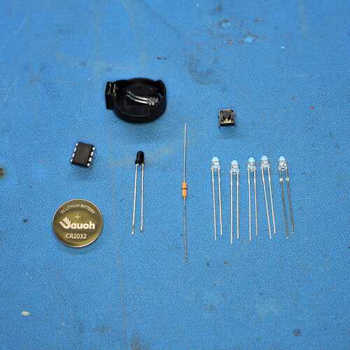 The full Open Sauce 2025 badge parts kit laid out